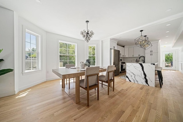 1135-1137 Hyde Park Ave Unit 1, Boston, MA 02136 - dining room with a chandelier, light wood-style flooring, and baseboards