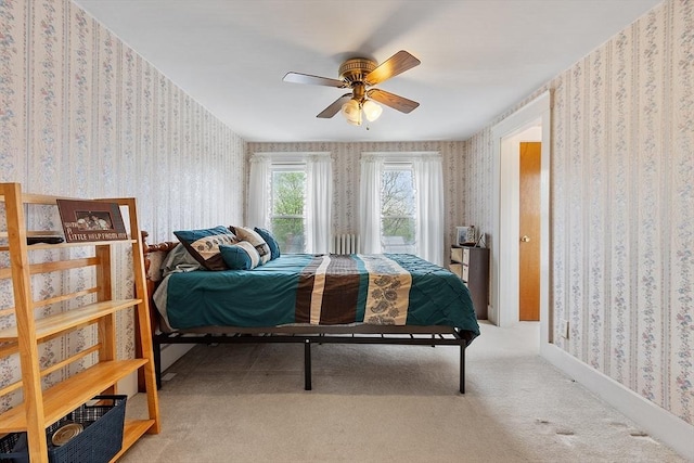 bedroom featuring wallpapered walls, carpet flooring, and a ceiling fan