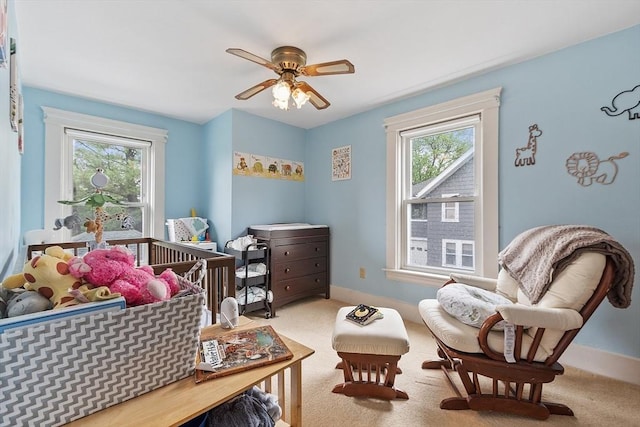 bedroom featuring carpet floors, baseboards, and a ceiling fan