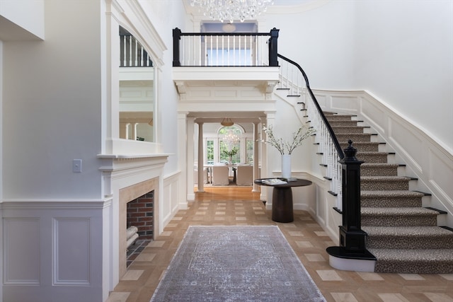 interior space with a chandelier and a high ceiling