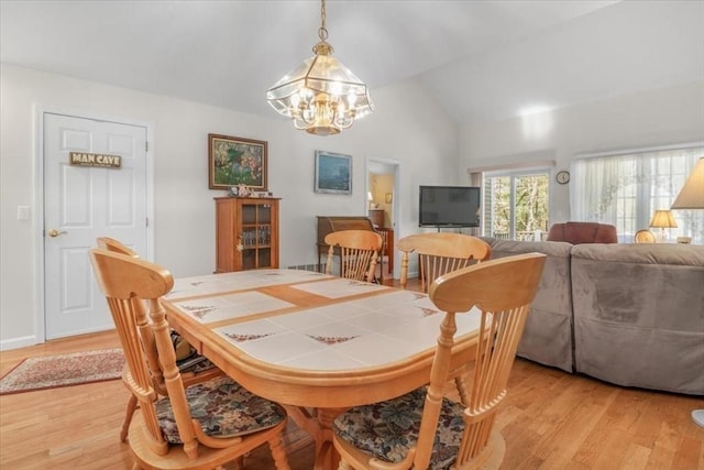 168 Cannon Forge Dr Unit 168, Foxboro, MA 02035 - dining area with a chandelier, light wood-style flooring, and lofted ceiling