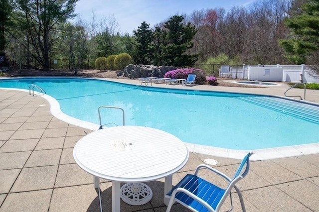 168 Cannon Forge Dr Unit 168, Foxboro, MA 02035 - community pool featuring a patio, a hot tub, and view of wooded area