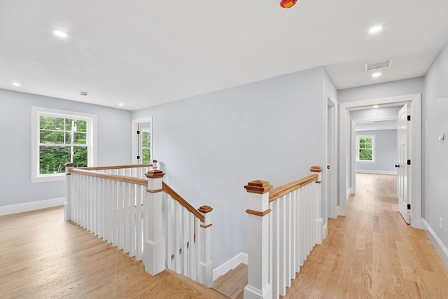 192 Tahattawan, Littleton, MA 01460 - corridor with an upstairs landing, light wood-style flooring, baseboards, and recessed lighting