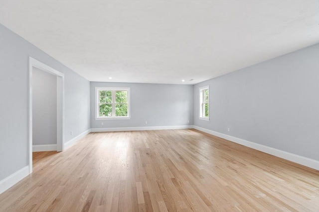 192 Tahattawan, Littleton, MA 01460 - unfurnished room with plenty of natural light, light wood-style floors, and baseboards