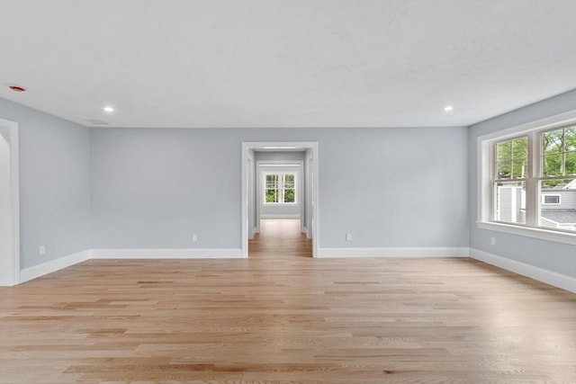 192 Tahattawan, Littleton, MA 01460 - empty room with healthy amount of natural light, light wood-style floors, baseboards, and recessed lighting
