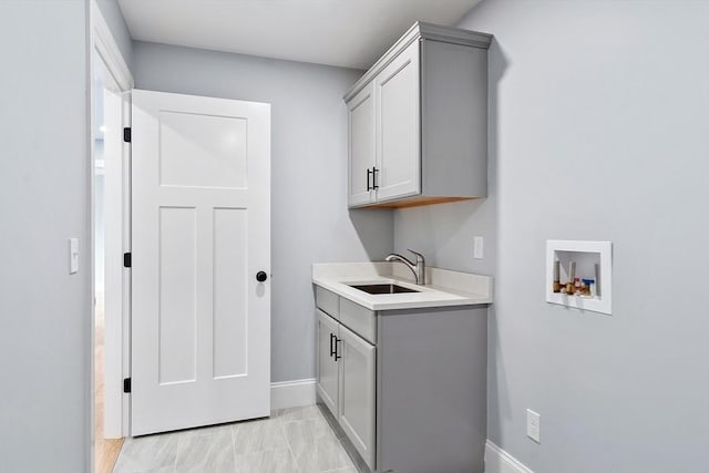 192 Tahattawan, Littleton, MA 01460 - washroom with washer hookup, cabinet space, and baseboards