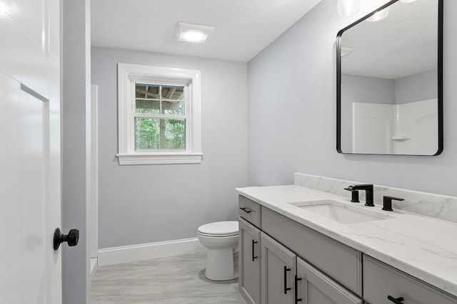 192 Tahattawan, Littleton, MA 01460 - bathroom featuring vanity, baseboards, and toilet