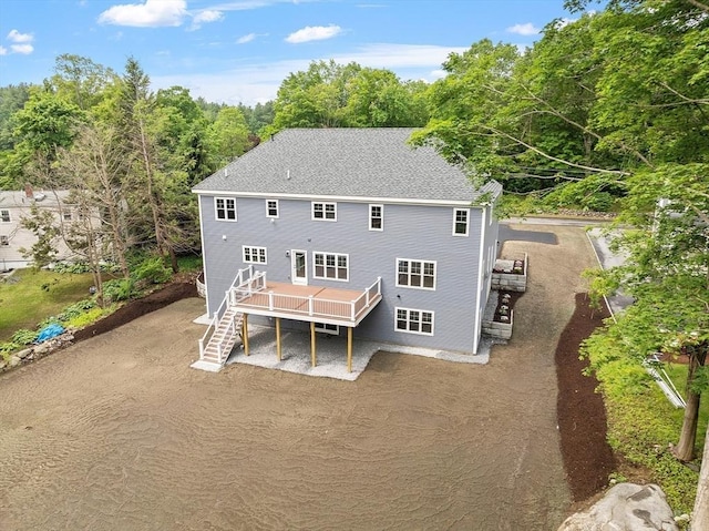 192 Tahattawan, Littleton, MA 01460 - rear view of house featuring stairway, a deck, and a shingled roof