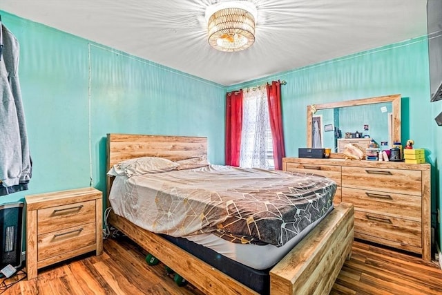 bedroom featuring wood finished floors