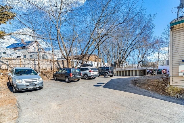 uncovered parking lot with fence