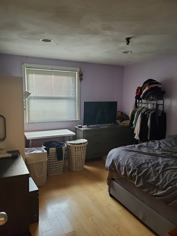 bedroom featuring light wood-type flooring