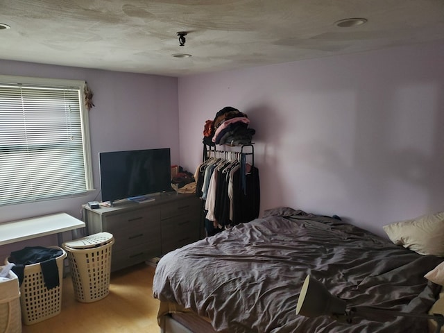 bedroom with wood finished floors