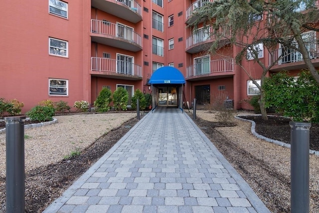 view of apartment building / complex with central air condition unit