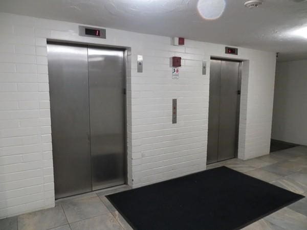 misc room with elevator