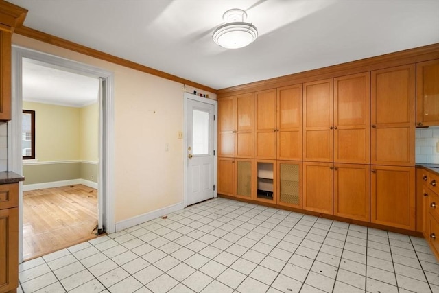 65 Kirkstall Rd, Newton, MA 02460 - empty room featuring crown molding and baseboards