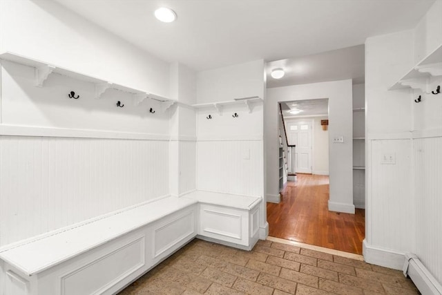 65 Kirkstall Rd, Newton, MA 02460 - mudroom featuring baseboard heating and wainscoting