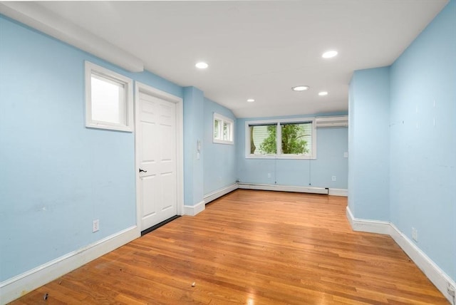65 Kirkstall Rd, Newton, MA 02460 - spare room featuring light wood-type flooring, a baseboard heating unit, and recessed lighting