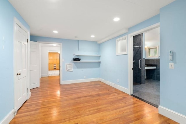 65 Kirkstall Rd, Newton, MA 02460 - empty room featuring light wood-style flooring and recessed lighting