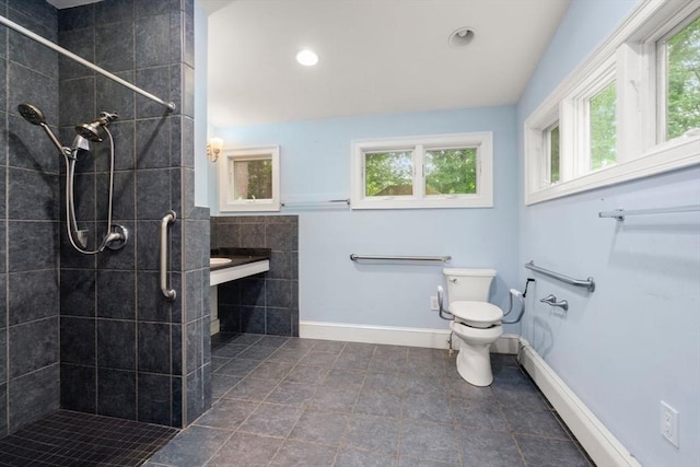 65 Kirkstall Rd, Newton, MA 02460 - bathroom featuring healthy amount of natural light, a tile shower, tile patterned flooring, and recessed lighting