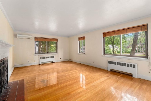 65 Kirkstall Rd, Newton, MA 02460 - unfurnished living room with radiator heating unit, a wall mounted air conditioner, wood finished floors, ornamental molding, and a tile fireplace