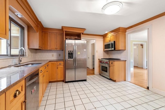 65 Kirkstall Rd, Newton, MA 02460 - kitchen featuring appliances with stainless steel finishes, tasteful backsplash, light stone counters, ornamental molding, and light tile patterned flooring