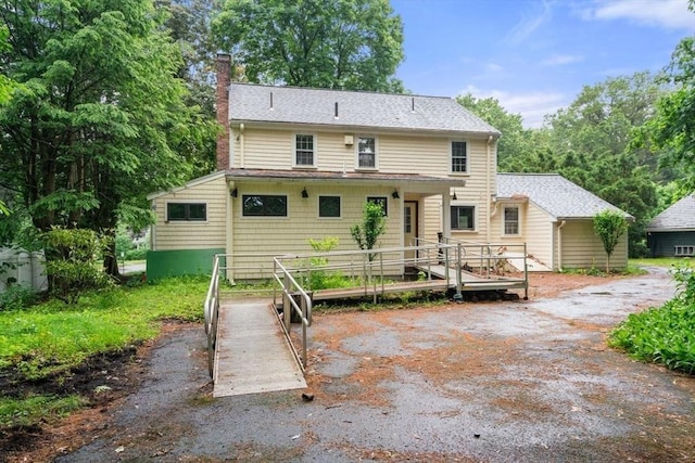 65 Kirkstall Rd, Newton, MA 02460 - rear view of property featuring a chimney