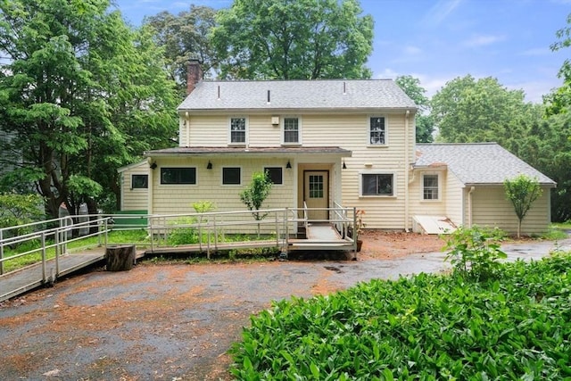 65 Kirkstall Rd, Newton, MA 02460 - back of property featuring a chimney