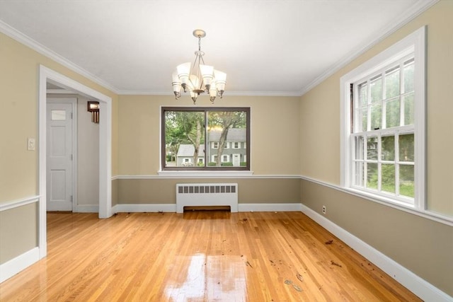 65 Kirkstall Rd, Newton, MA 02460 - unfurnished dining area featuring radiator heating unit, a chandelier, light wood-type flooring, and ornamental molding