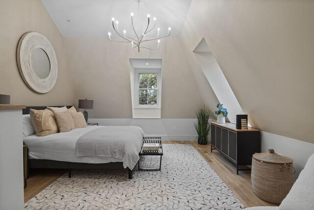 17 Alveston St Unit A, Boston, MA 02130 - bedroom with an inviting chandelier, lofted ceiling, and wood finished floors