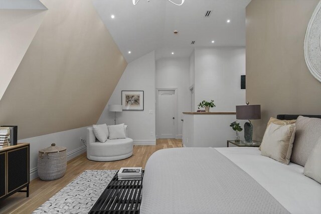 17 Alveston St Unit A, Boston, MA 02130 - bedroom featuring visible vents, baseboards, recessed lighting, wood finished floors, and high vaulted ceiling
