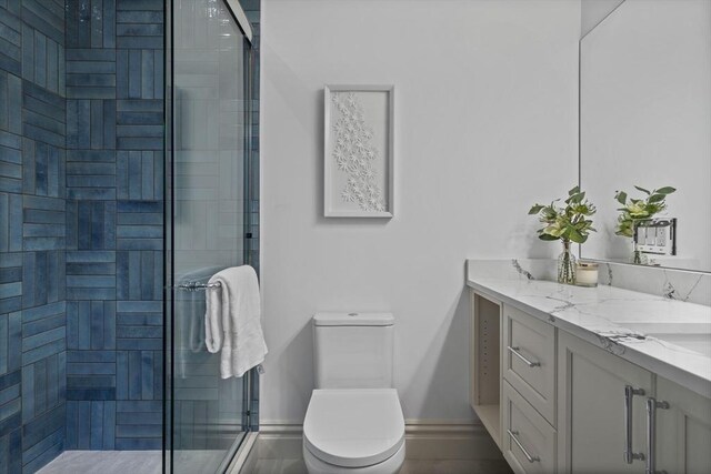 17 Alveston St Unit A, Boston, MA 02130 - full bath with a shower stall, toilet, vanity, and baseboards