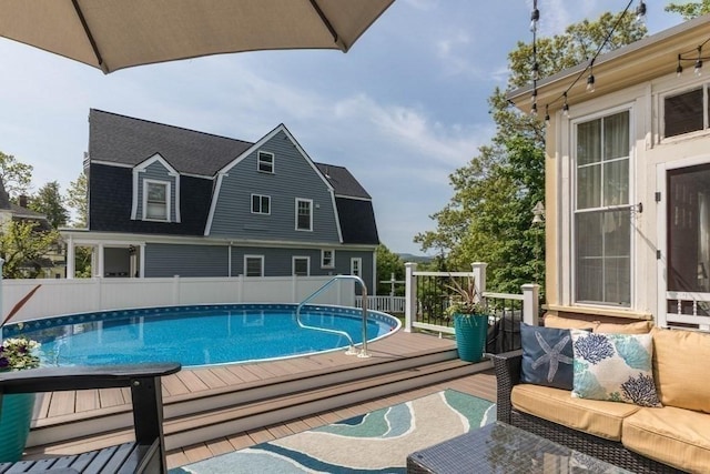 44 Fairview St, Fitchburg, MA 01420 - view of swimming pool featuring fence, a wooden deck, a fenced in pool, and an outdoor hangout area