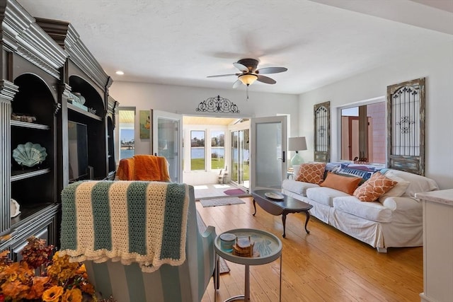 living room featuring light wood-type flooring, recessed lighting, french doors, and ceiling fan