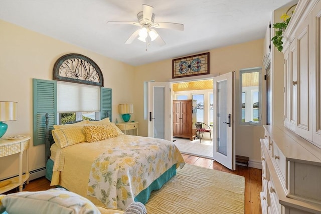 bedroom featuring light wood-style floors and ceiling fan