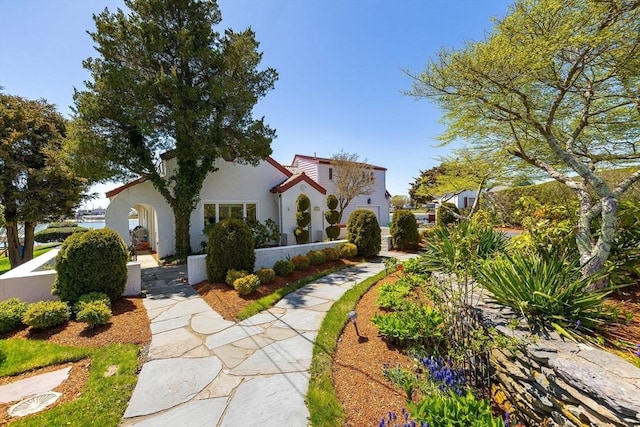mediterranean / spanish-style home with stucco siding