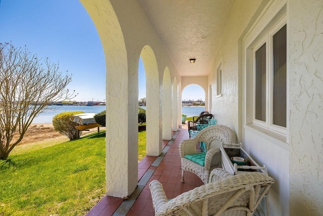 view of patio / terrace with a water view