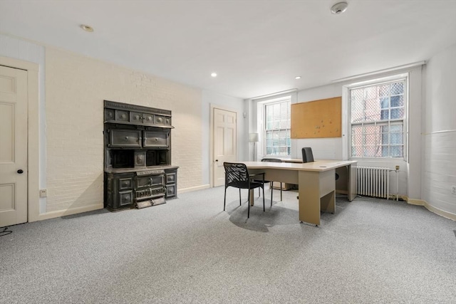 carpeted office with radiator and recessed lighting