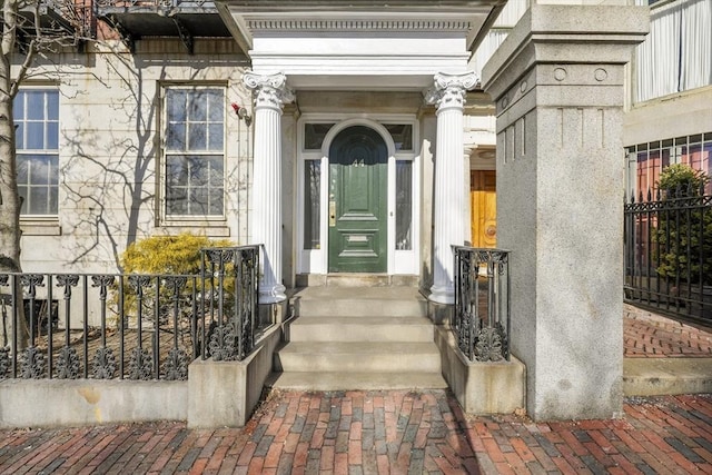 entrance to property with stone siding