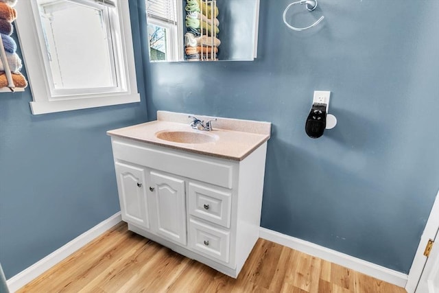 bathroom featuring vanity and wood-type flooring