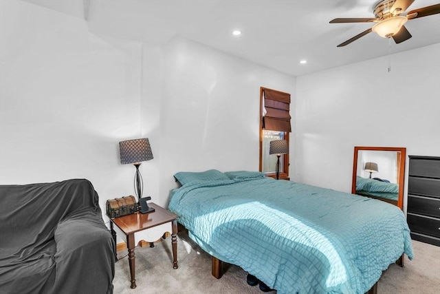 carpeted bedroom with ceiling fan