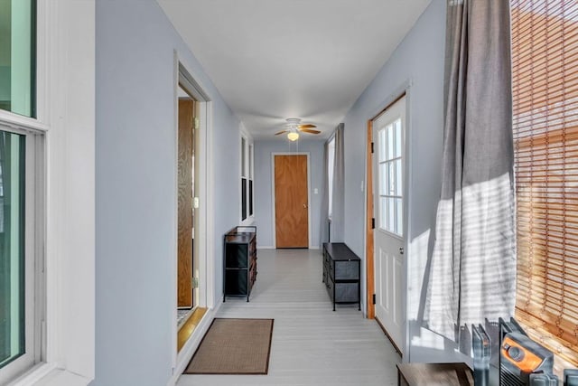 hallway featuring light wood-type flooring