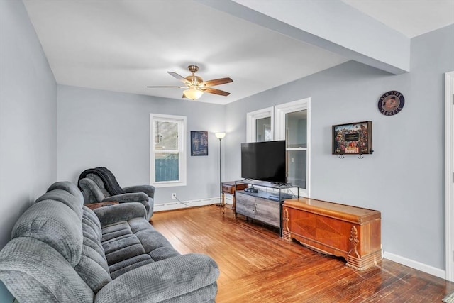 living room featuring hardwood / wood-style floors, ceiling fan, and baseboard heating