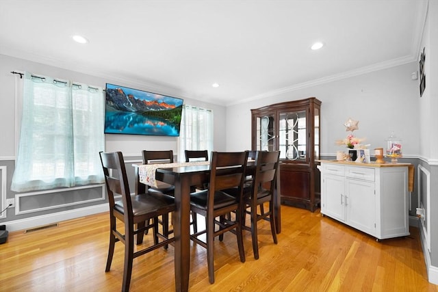489 Main St, Acushnet, MA 02743 - dining room with crown molding, light wood finished floors, and recessed lighting