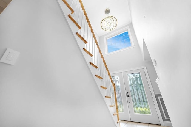 489 Main St, Acushnet, MA 02743 - entryway featuring stairs, healthy amount of natural light, light tile patterned floors, and a towering ceiling