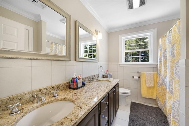489 Main St, Acushnet, MA 02743 - bathroom with tile walls, double vanity, tile patterned floors, plenty of natural light, and ornamental molding