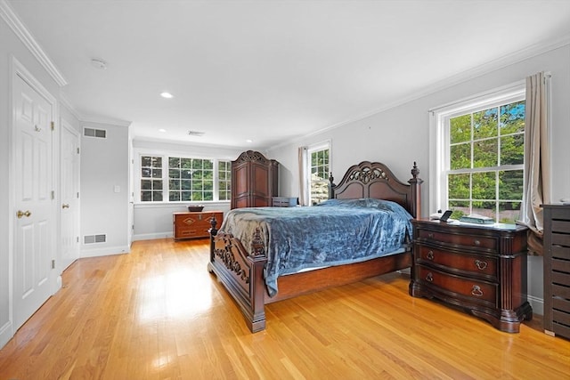 489 Main St, Acushnet, MA 02743 - bedroom with light wood finished floors, multiple windows, ornamental molding, and recessed lighting