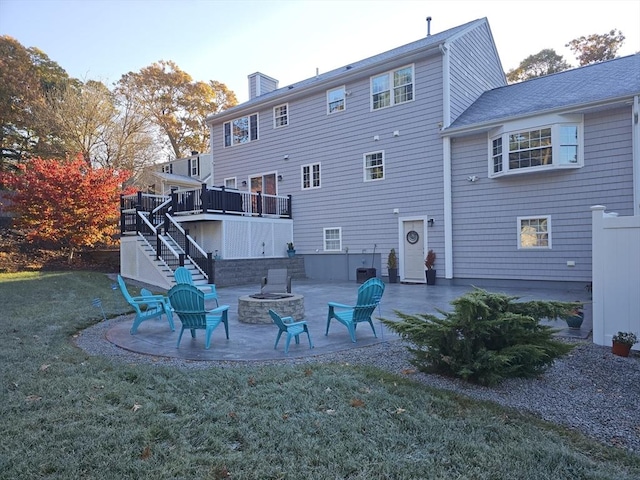 489 Main St, Acushnet, MA 02743 - rear view of house featuring an outdoor fire pit, stairs, a patio, a lawn, and a wooden deck