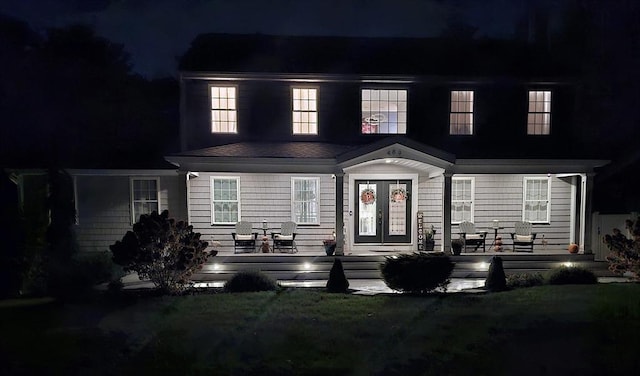 489 Main St, Acushnet, MA 02743 - view of front of house featuring french doors, a porch, and a lawn