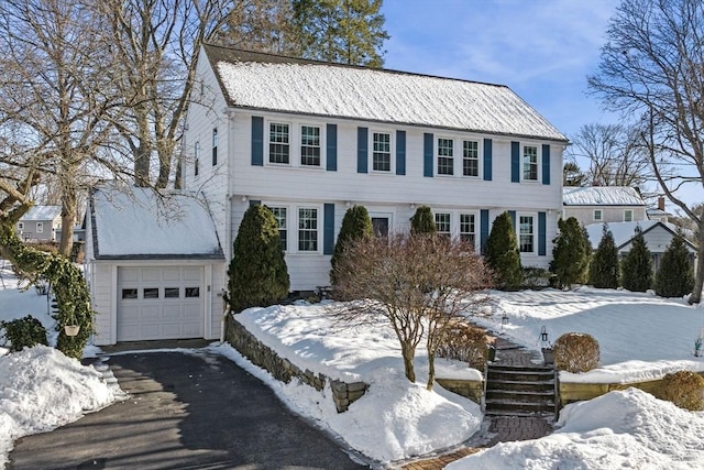 view of front of home featuring a garage and driveway