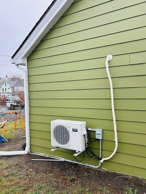 view of side of property with ac unit